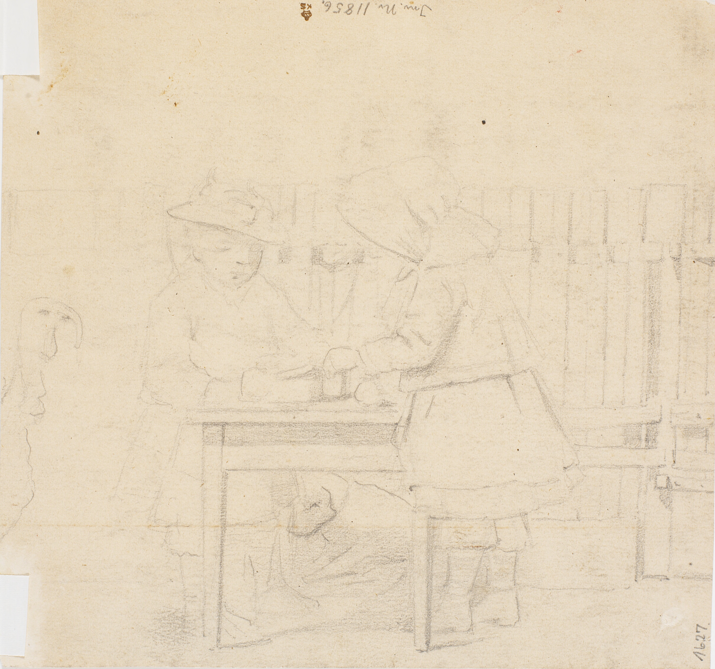 To små piger med mamelukker ved et bord i det fri